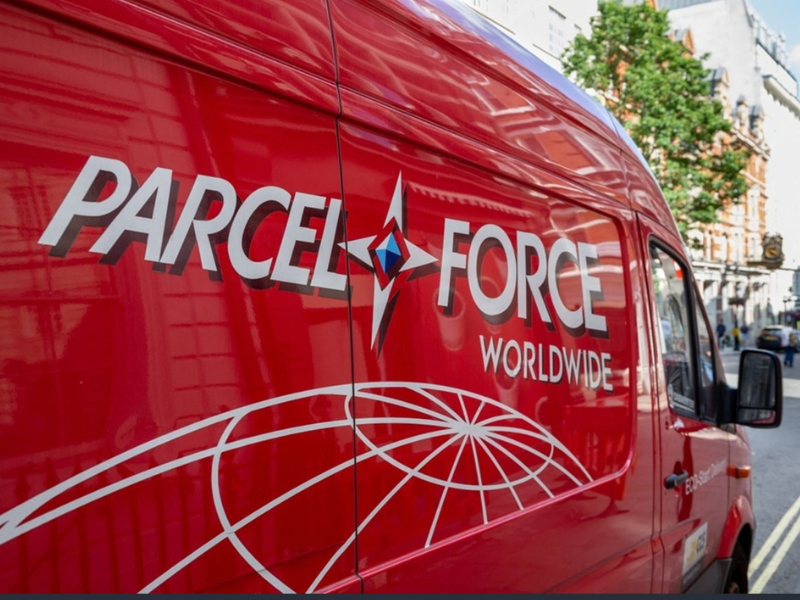 Red Parcel Force van on a city street